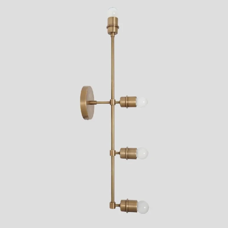 Adjustable Wall Lamps for Task Lighting in BathroomsAdjustable Wall Lamps for Task Lighting in BathroomsModern brass 4 lights wall lamp beside sconce